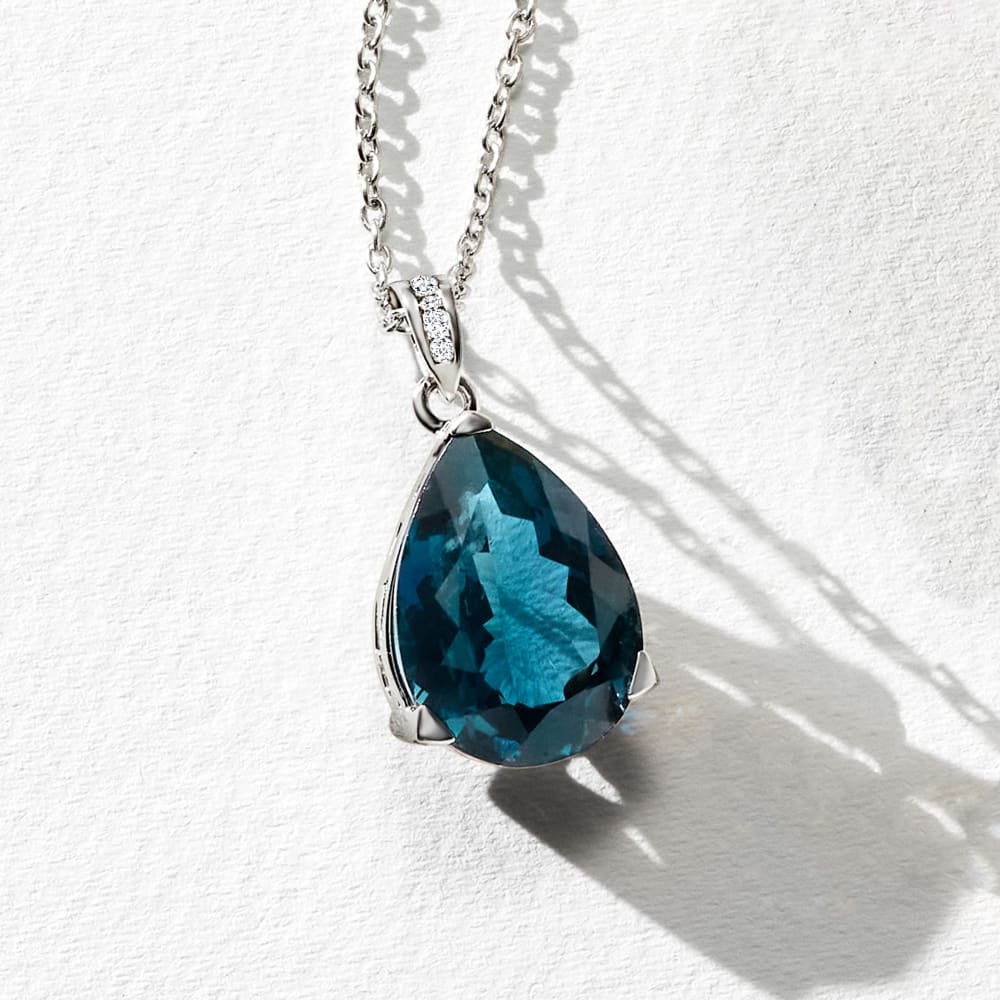 Breathtaking London Blue Topaz and 1/20 carat Diamond Pendant in Sterl –  Heartland Fine Jewelry