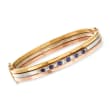 C. 1930 Vintage .60 ct. t.w. Diamond and .50 ct. t.w. Sapphire Bangle Bracelet in 14kt Tri-Colored Gold
