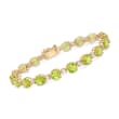 14.00 ct. t.w. Peridot and 1.80 ct. t.w. White Topaz Tennis Bracelet in 18kt Gold Over Sterling