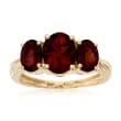 3.70 ct. t.w. Oval Garnet Three-Stone Ring in 14kt Yellow Gold