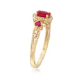 .60 ct. t.w. Ruby and .11 ct. t.w. Diamond Halo Ring in 14kt Yellow Gold