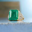 8.00 Carat Emerald and .40 ct. t.w. White Topaz Ring in 14kt Gold Over Sterling