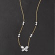 .50 ct. t.w. Baguette and Round Diamond Butterfly Necklace in 14kt Two-Tone Gold