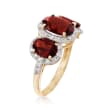 3.90 ct. t.w. Garnet and .27 ct. t.w. Diamond Three-Stone Ring in 14kt Yellow Gold