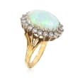 C. 1970 Vintage Oval Cabochon Opal Ring with 1.00 ct. t.w. Diamond Halo in 18kt Yellow Gold