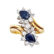 C. 1980 Vintage 1.50 ct. t.w. Sapphire and 1.40 ct. t.w. Diamond Bypass Ring in 18kt Yellow Gold