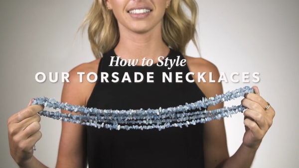 Torsade necklace YouTube video. Model showing how to style.
