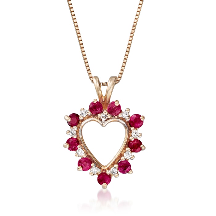 C. 1980 Vintage .65 ct. t.w. Ruby Heart Pendant Necklace with Diamond Accents in 14kt Yellow Gold