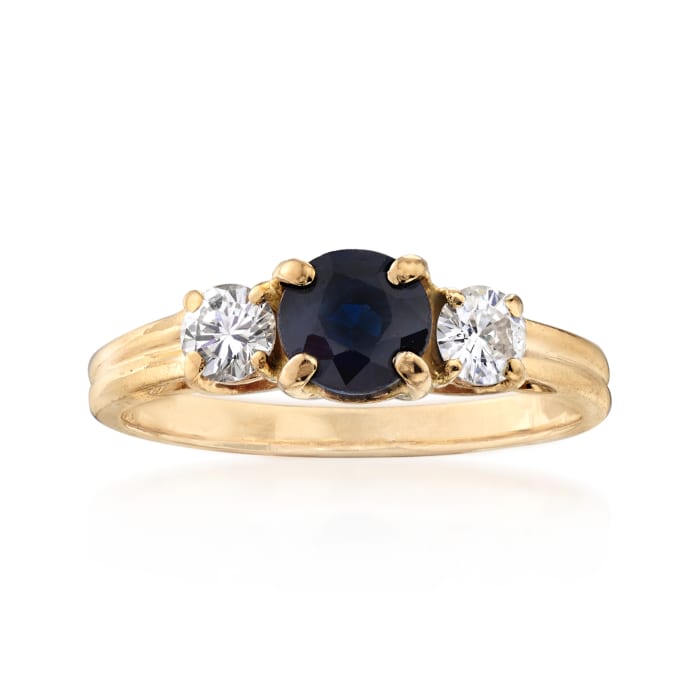 C. 1980 Vintage .75 Carat Sapphire and .40 ct. t.w. Diamond Three-Stone Ring in 14kt Yellow Gold